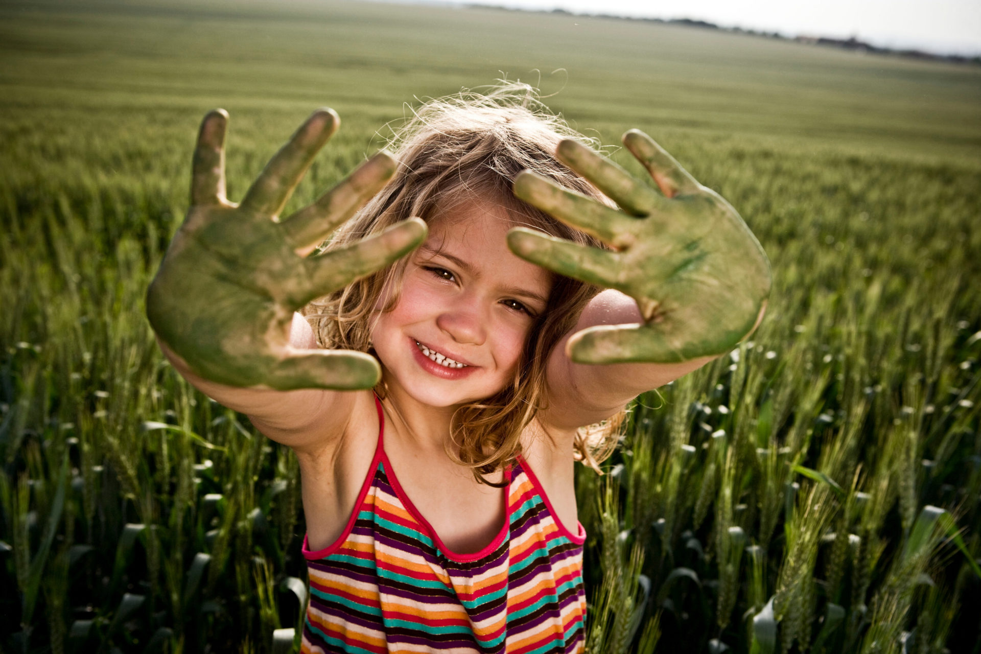 Girl with painted green hands